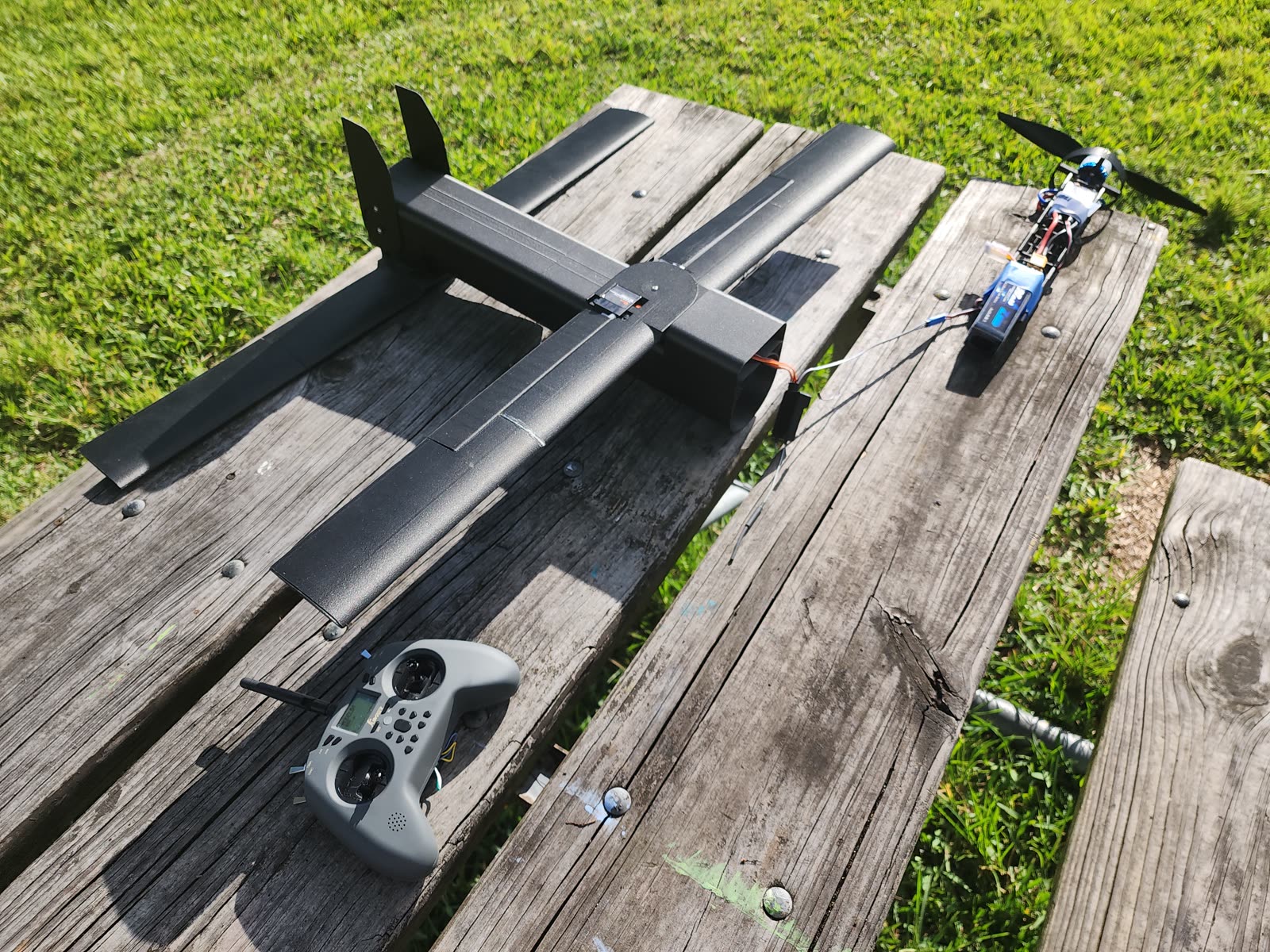 Assembled fixed-wing UAV prototype on a field table